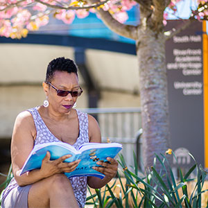 Woman studying on bench at Pottstown Campus