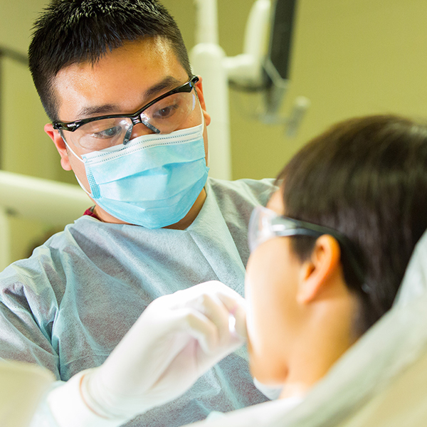 Dental student working on patient