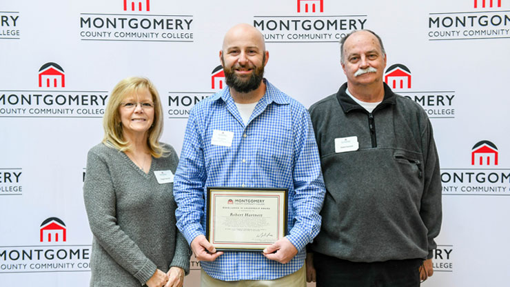 Montco 2018 graduate Bob Hartnett (center), standing with his parents Peggy and Robert Hartnett, received the Excellence in Leadership Award for his leadership of the College’s Veterans Club.