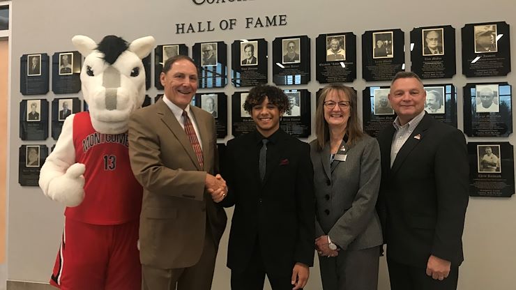 The Montgomery County Coaches Hall of Fame Board of Directors awards a $2,000 scholarship to Montgomery County Community College student Avian Garcia of Hatfield. From left: Dale Hood, Montgomery County Coaches Hall of Fame President; Avian Garcia, MCCC student; Dr. Victoria Bastecki-Perez, MCCC Interim President; and Jay Browning, MCCC Vice President for Advancement. Photo by Matthew Moorhead