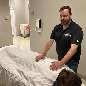 Bill Mullen massages a client.