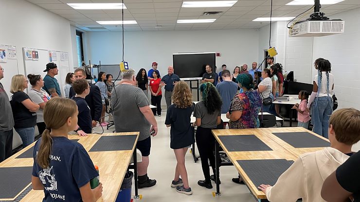 Andy Bachman, a Pottstown math and engineering teacher (center), spoke to the students and their families about the immersive STEM-based Montco 360 program at Montgomery County Community College during an open house on July 31. The new program is a collaboration between the College and the Pottstown School District. Photo by Diane VanDyke