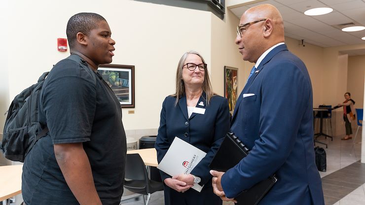 student talking to Auditor General