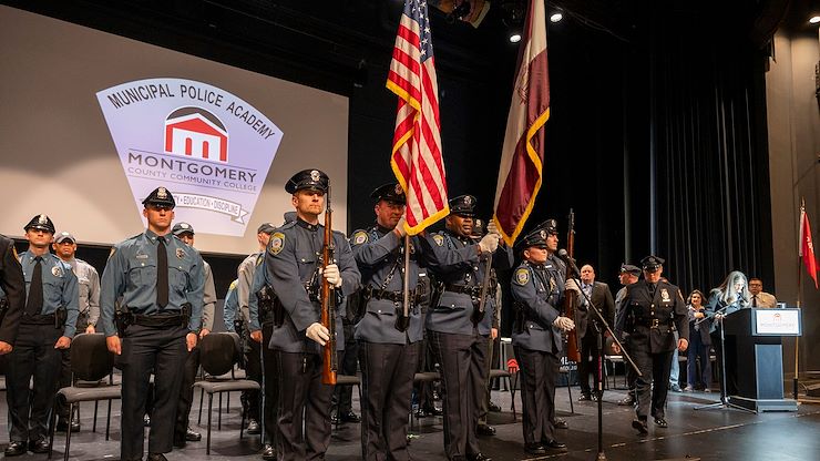 The Abington Township Police Department Color Guard stands at attention during the Montgomery County Community College Municipal Police Academy graduation ceremony. Photos by Linda Johnson