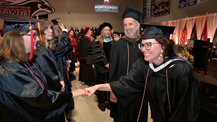 fist-bumping faculty fist-bumping faculty