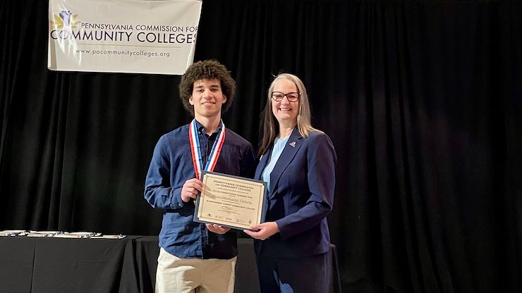 Massimiliano Simon and Dr. Vicki Bastecki-Perez, MCCC President, at the All-Pennsylvania Academic Team awards ceremony in Harrisburg. Simon received the $1,000 Chime Workforce Scholarship from the Phi Theta Kappa Foundation. Photo by Diane Van Dyke
