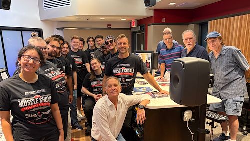 Twelve Sound Recording and Music Technology students attending the Muscle Shoals Recording Residency gather in the Mix Room on the Blue Bell Campus for a send off ahead of their trip