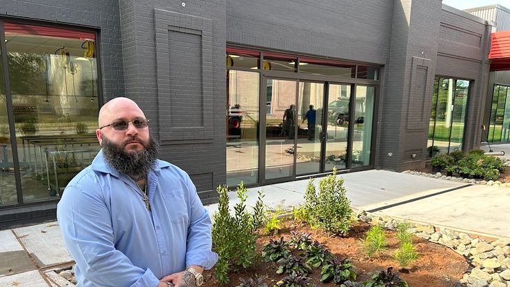 Culinary Arts major Christopher MacWilliams stands in front of the new Hospitality Institute on the Blue Bell Campus that will open soon. MacWilliams recently was named the recipient of the Paul Decker & Valley Forge Tourism & Convention Board Hospitality Scholarship. Photo by Eric Devlin