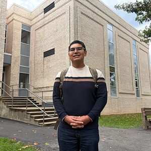 Oscar Amador stands outside the Science Center on the Blue Bell Campus. 